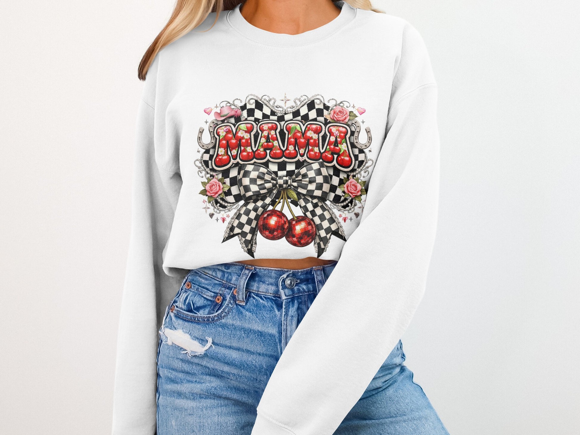 White sweatshirt with "Mama" in checkered pattern and cherries.