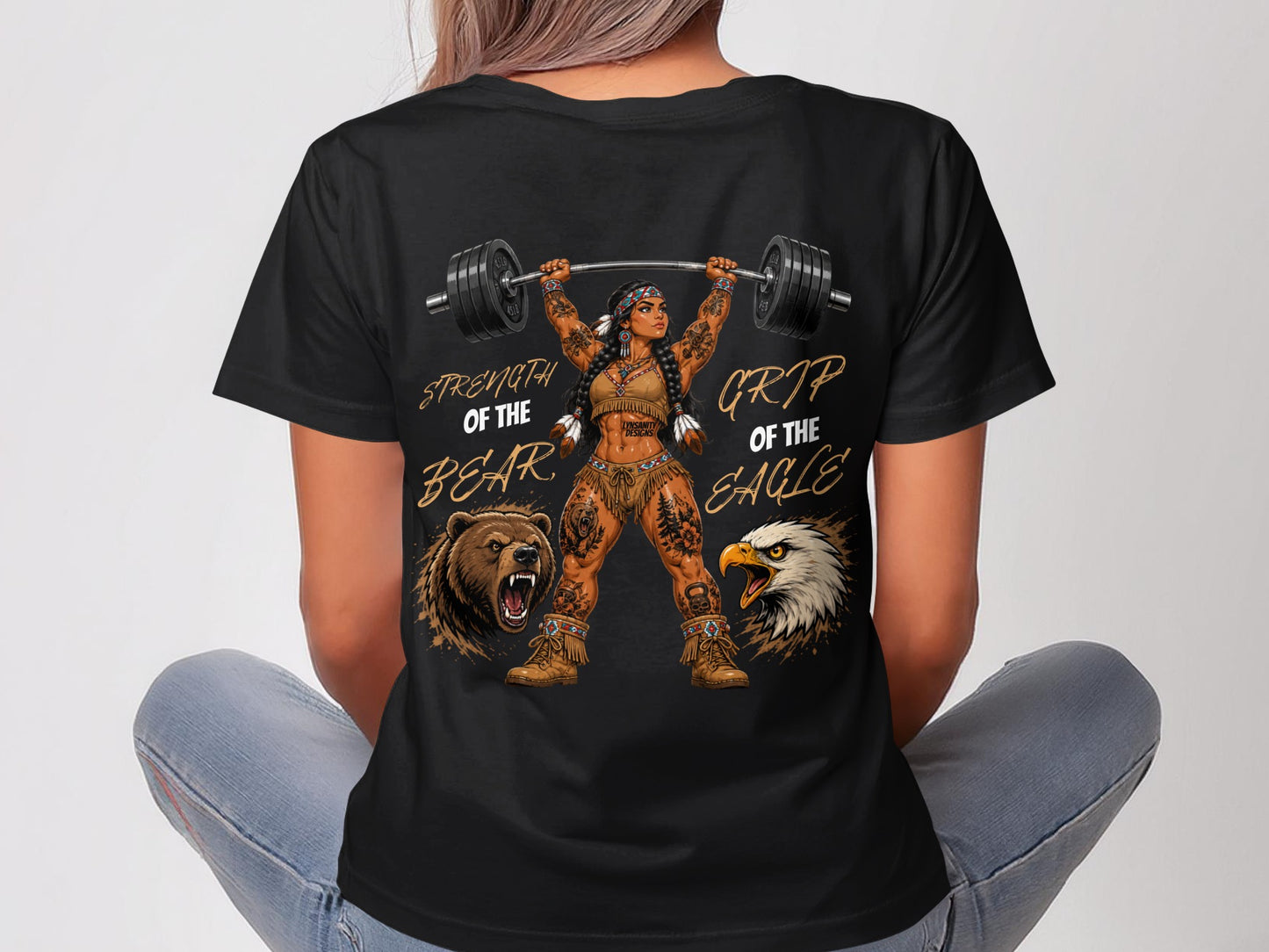 Woman in black t-shirt lifting barbell, Native American imagery, "Strength of the Bear, Grip of the Eagle".
