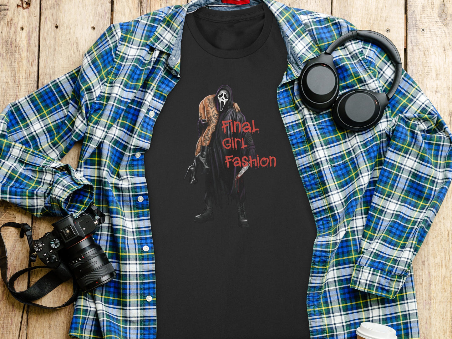 Black t-shirt with graphic of Ghostface from Scream, holding a bloody knife.