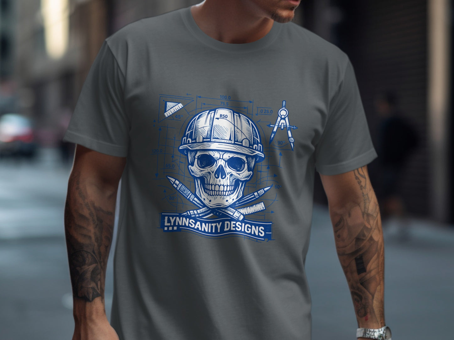 Skull and compass on blueprint with "LYNNSANITY DESIGNS" text.