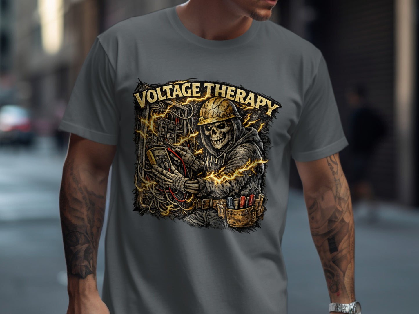 Skeleton electrician with "Voltage Therapy" text and lightning bolts on grey t-shirt.