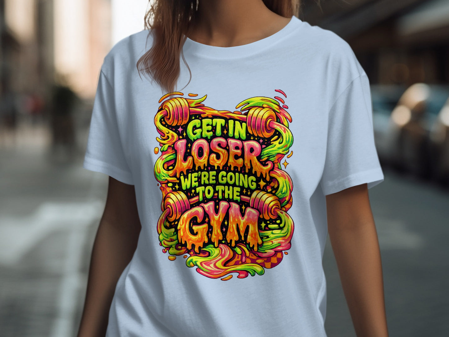 White t-shirt with colorful "Get in loser, we're going to the gym" text.