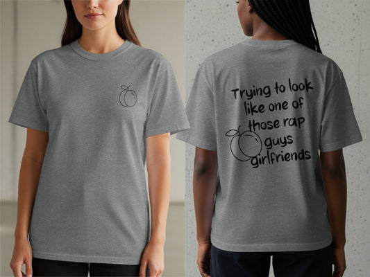 Gray t-shirt with peach graphic on front and rap lyrics on back.