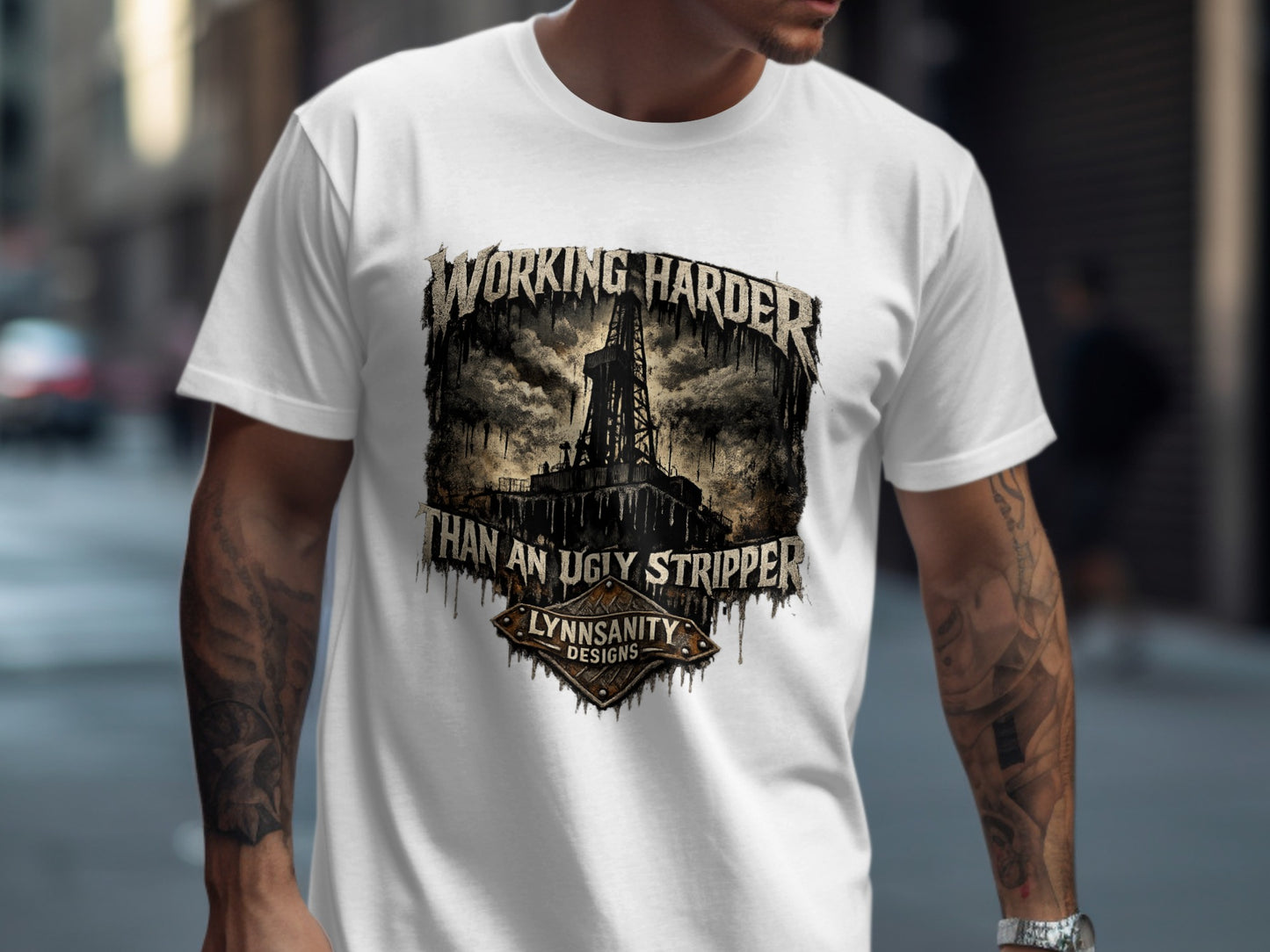 White t-shirt with "WORKING HARDER THAN AN UGLY STRIPPER" graphic.