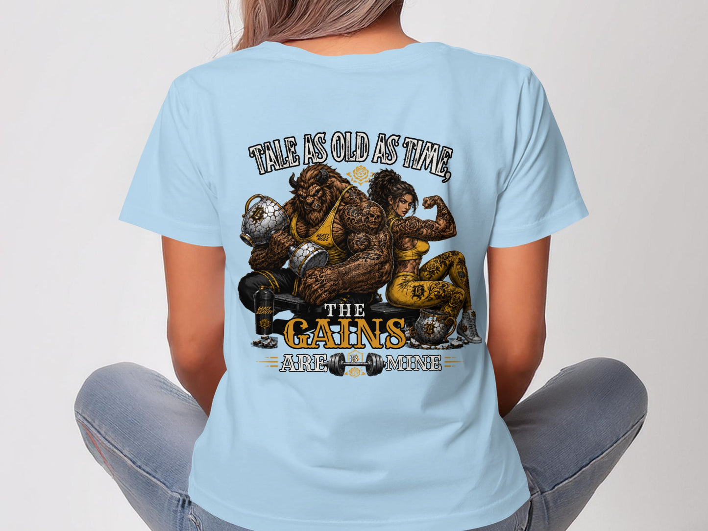Beast and woman with muscular arms holding weights, text reads "Tale as old as time, the gains are all mine".