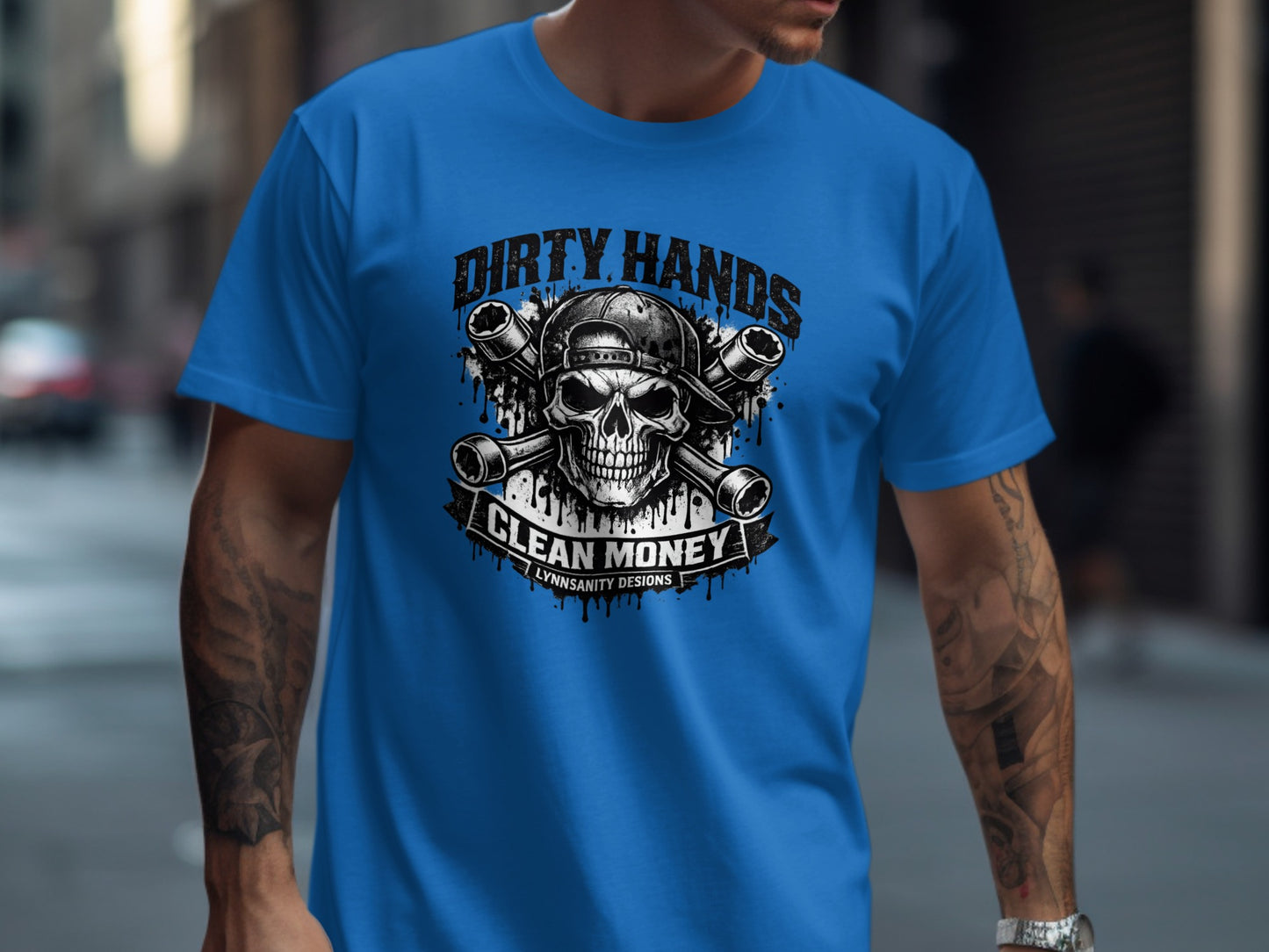Blue t-shirt with skull, wrenches, and "Dirty Hands Clean Money" text.