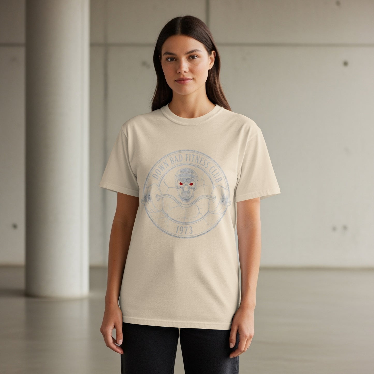 Cream t-shirt with distressed "DOWN BAD FITNESS CLUB 1973" circular graphic.