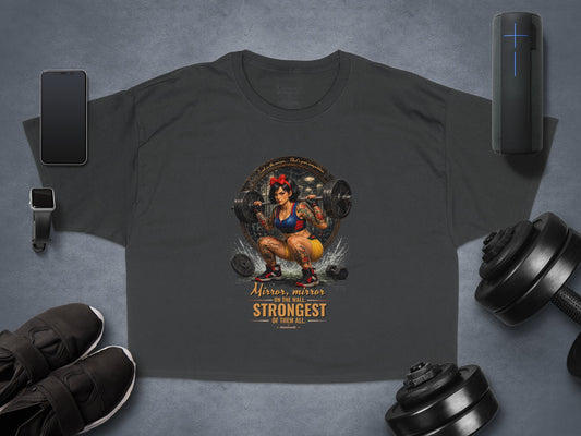 T-shirt with tattooed woman lifting weights, text "Mirror, mirror... Strongest of them all."