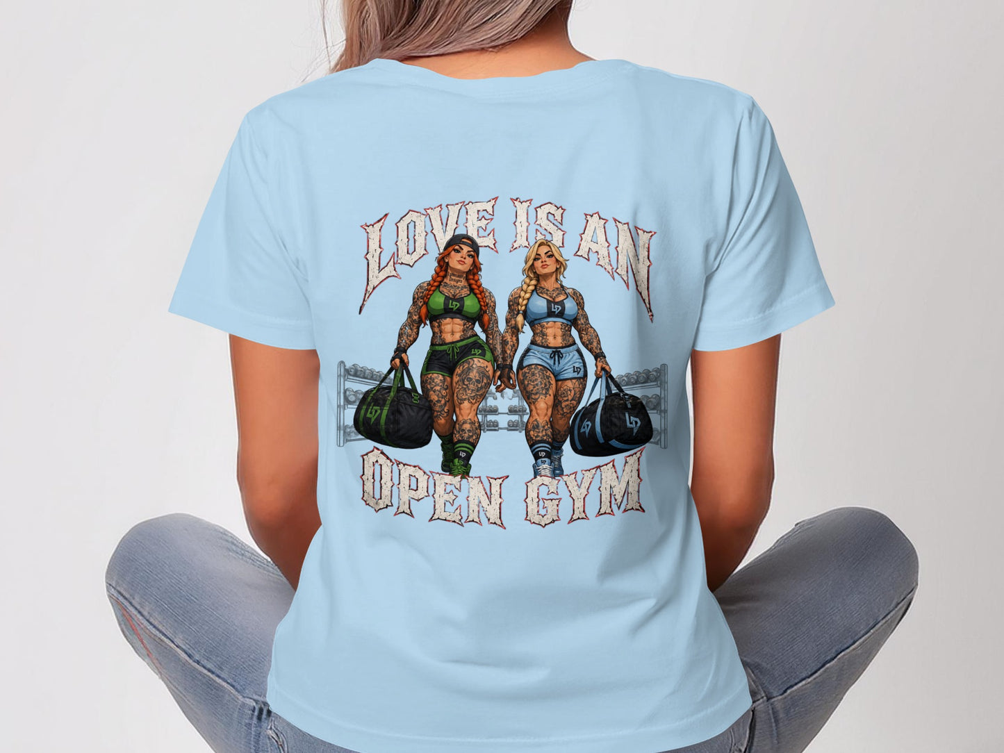 Two muscular women with gym bags, "LOVE IS AN OPEN GYM" text.