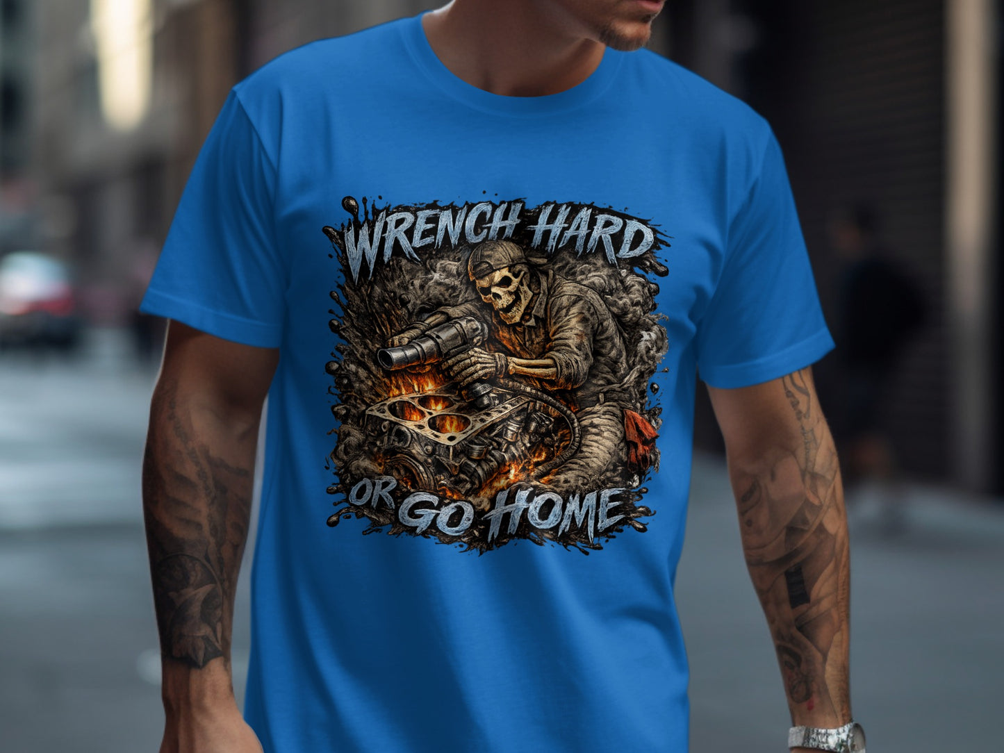 Blue t-shirt with "Wrench Hard or Go Home" text and skeleton mechanic graphic.