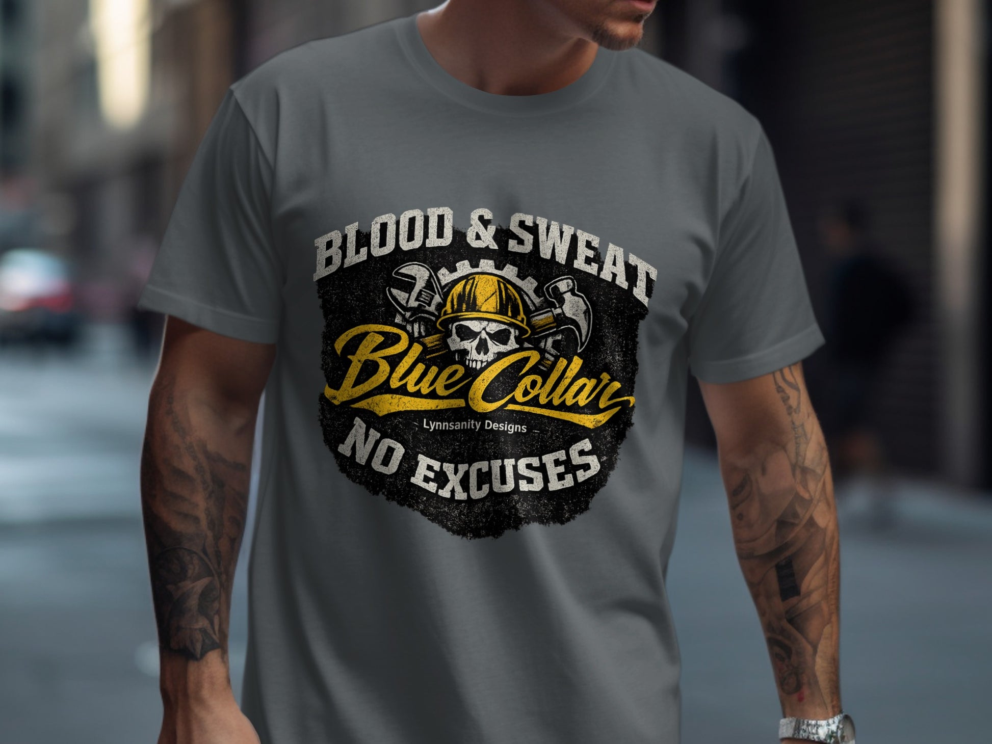 Gray t-shirt with skull, hard hat, and tools graphic: "Blood & Sweat, No Excuses".