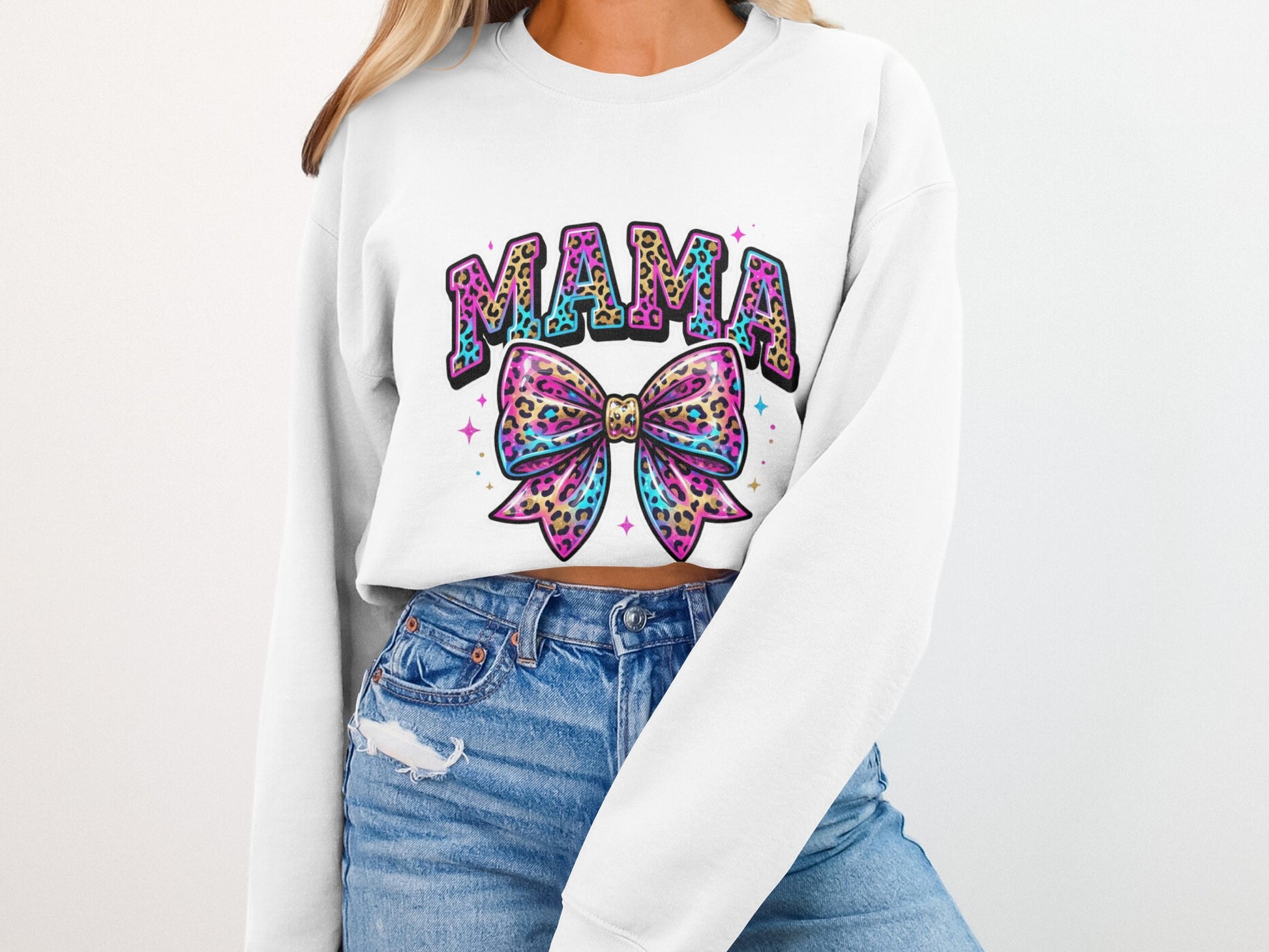 White sweatshirt with "MAMA" text and leopard print bow graphic.
