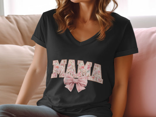 Black v-neck t-shirt with "MAMA" in floral print and a pink bow.