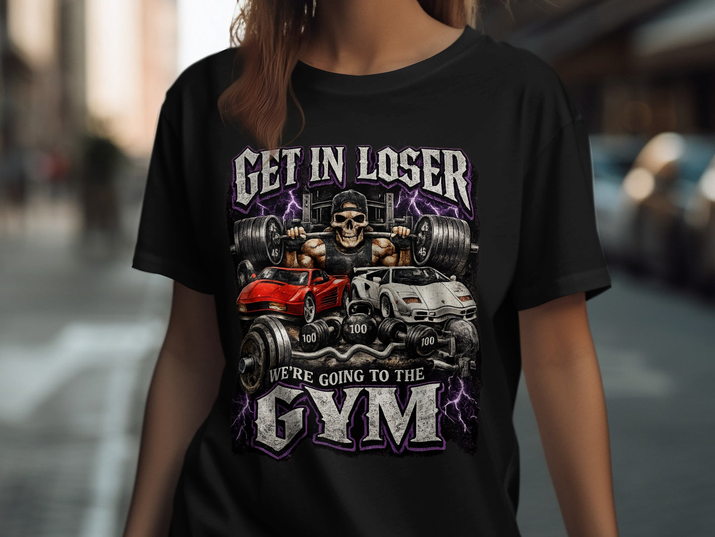 Black t-shirt with skull lifting weights, sports cars, and "GET IN LOSER WE'RE GOING TO THE GYM".