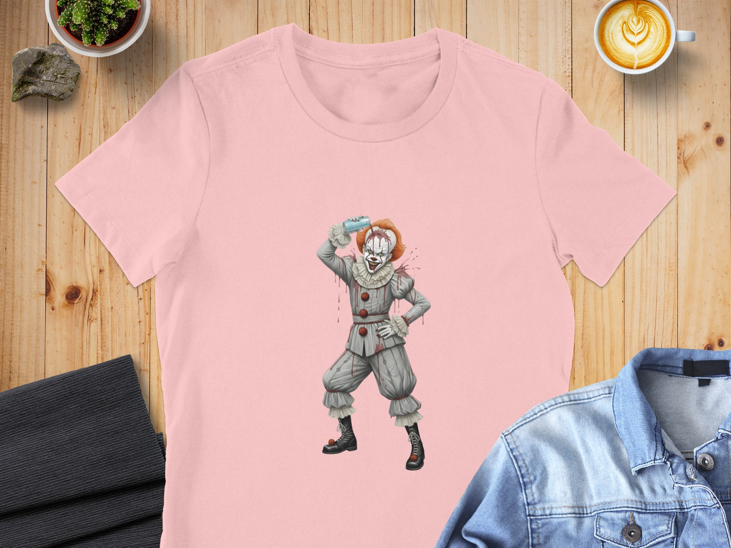 Pink t-shirt featuring a cartoon Pennywise the clown with a blue bottle.