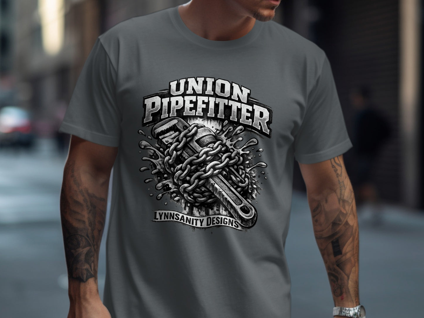 T-shirt graphic with chained pipe wrench and "Union Pipefitter" text.