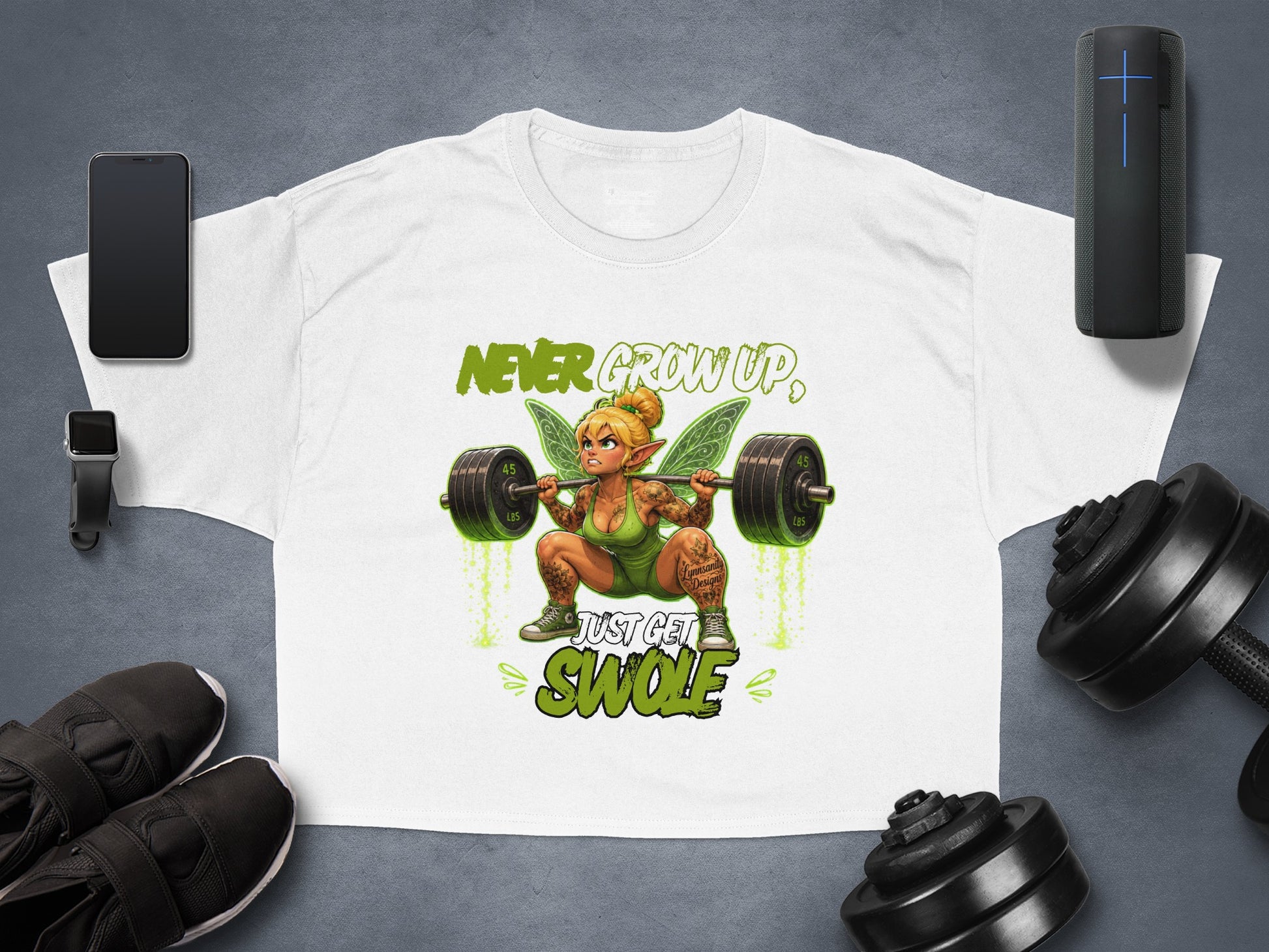 T-shirt with fairy lifting weights, text reads "Never Grow Up, Just Get Swole".