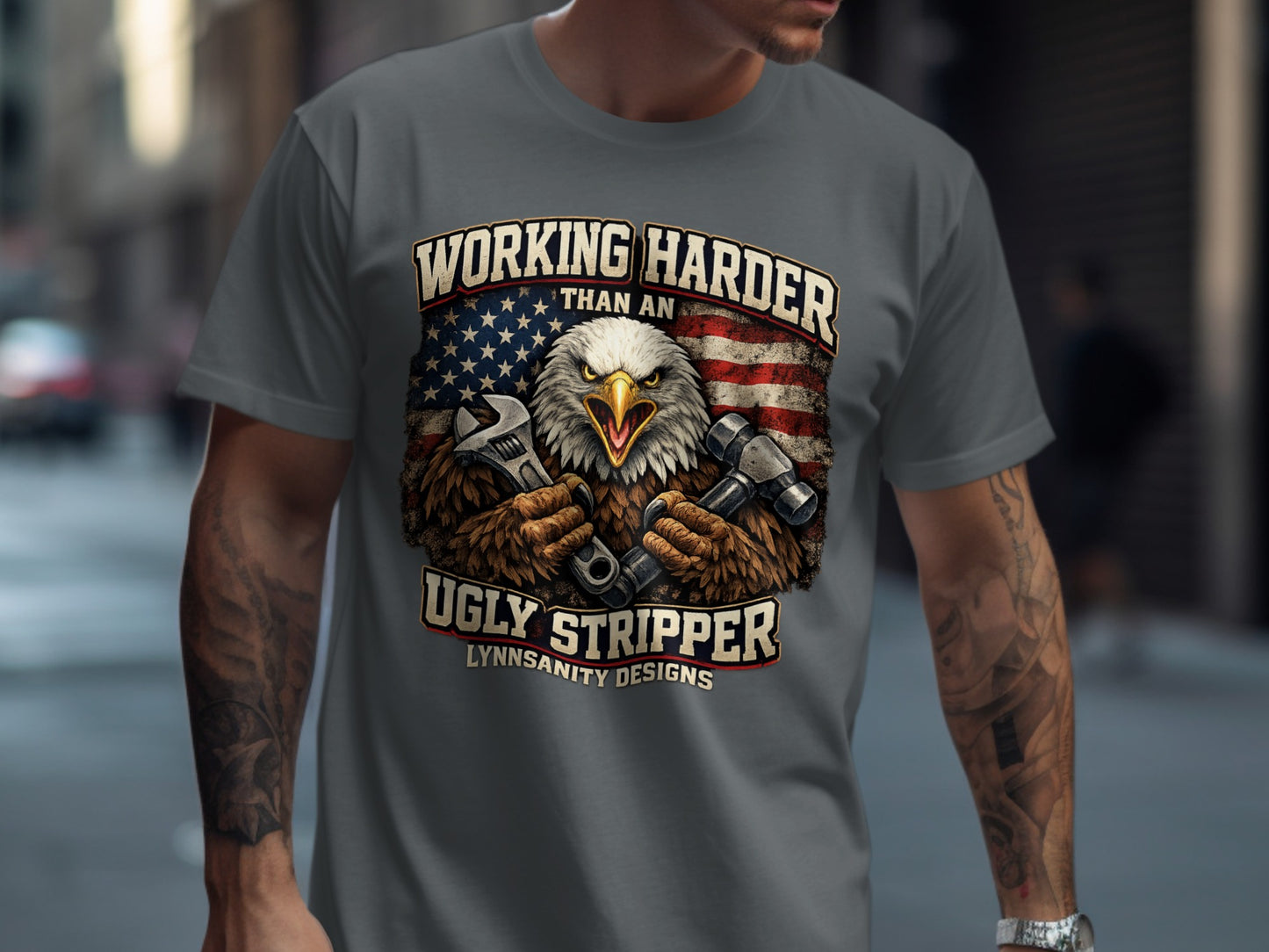 Eagle with tools and American flag on t-shirt.