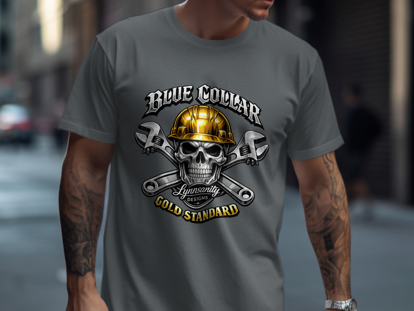 T-shirt graphic: skull wearing hard hat, crossed wrenches, "Blue Collar Gold Standard".