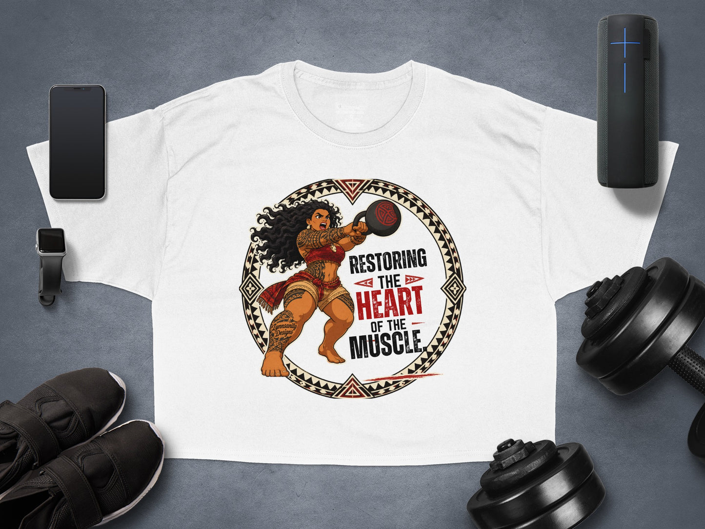 White t-shirt with graphic of woman lifting kettlebell and text "Restoring the Heart of the Muscle."