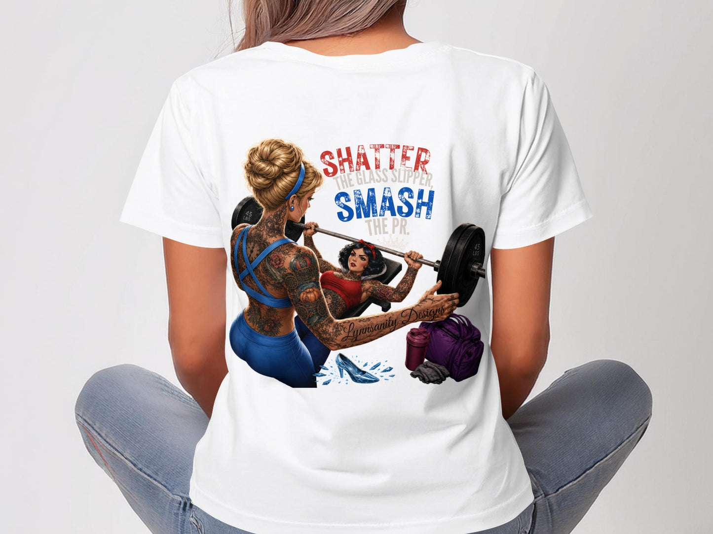 Woman in white t-shirt with "Shatter the glass slipper, smash the pr." graphic.