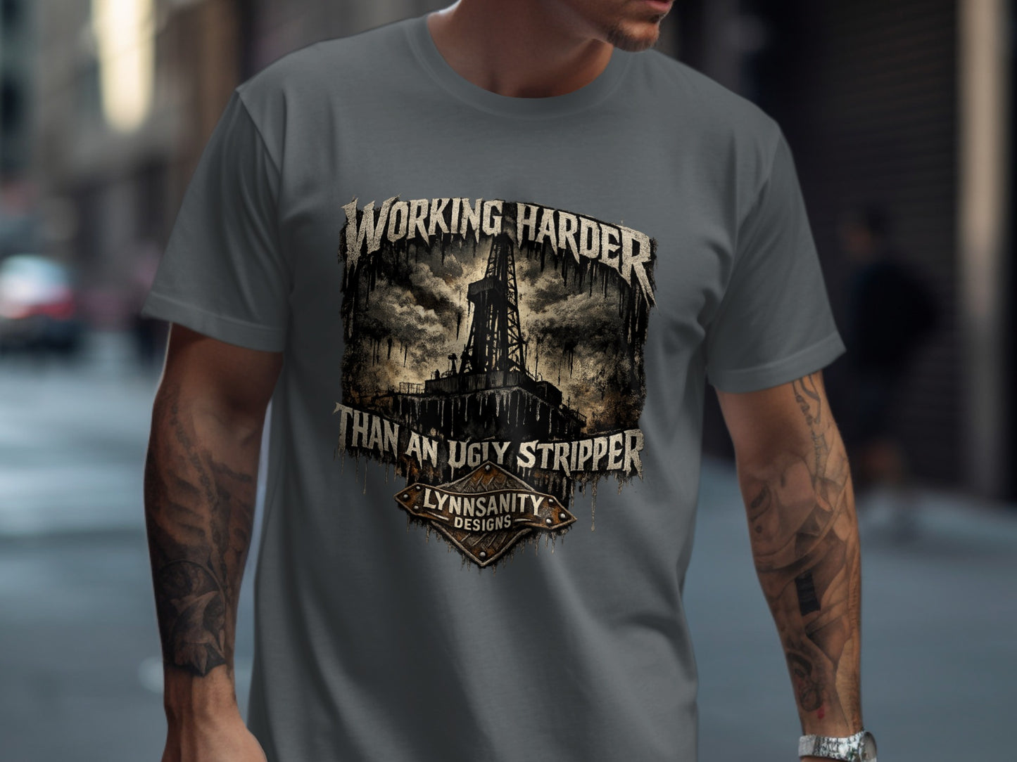 T-shirt with "Working Harder Than an Ugly Stripper" text and oil rig graphic.