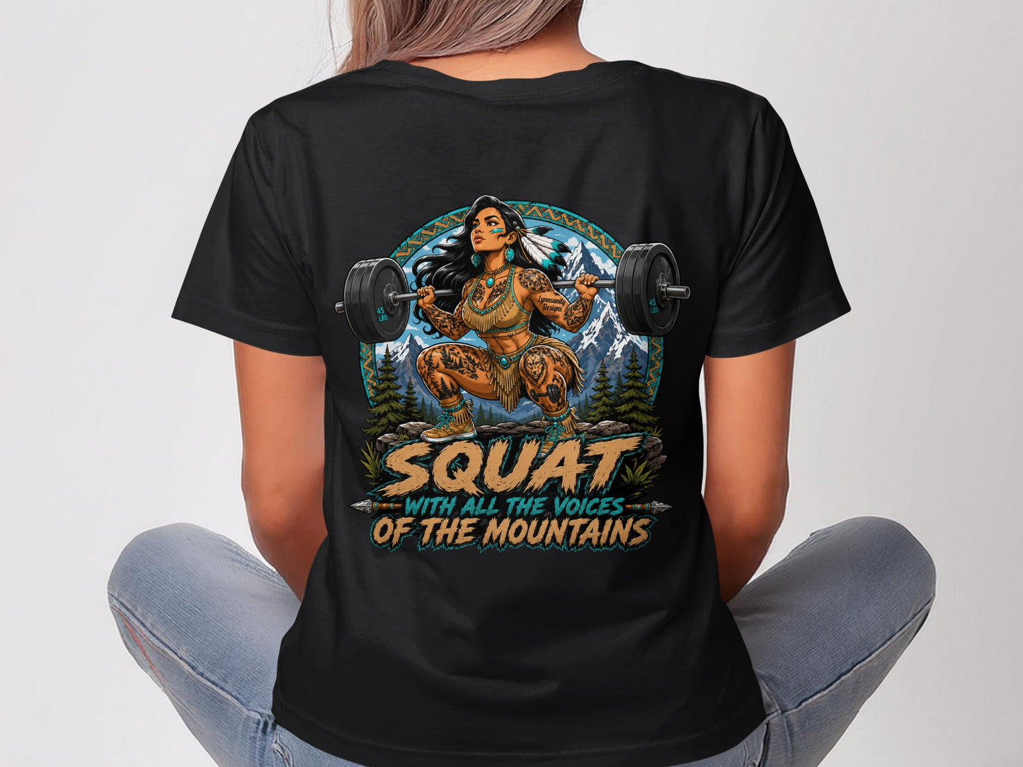 Woman wearing black t-shirt with Native American inspired art and text.
