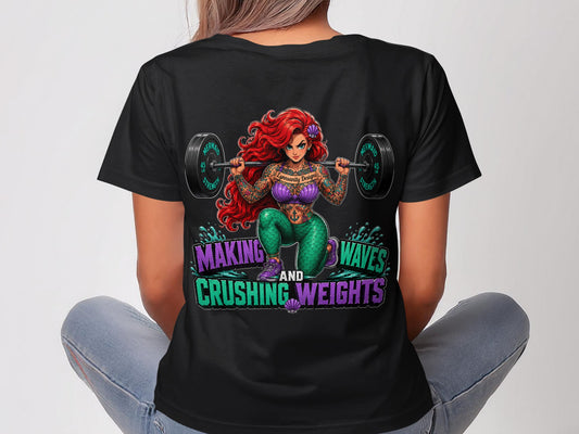 Tattooed Ariel on black t-shirt with weightlifting text and barbell.