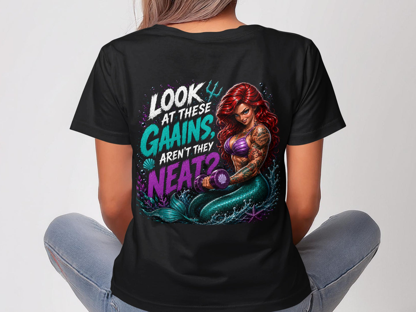 Mermaid lifting weights with text: "Look at these gains, aren't they neat?"