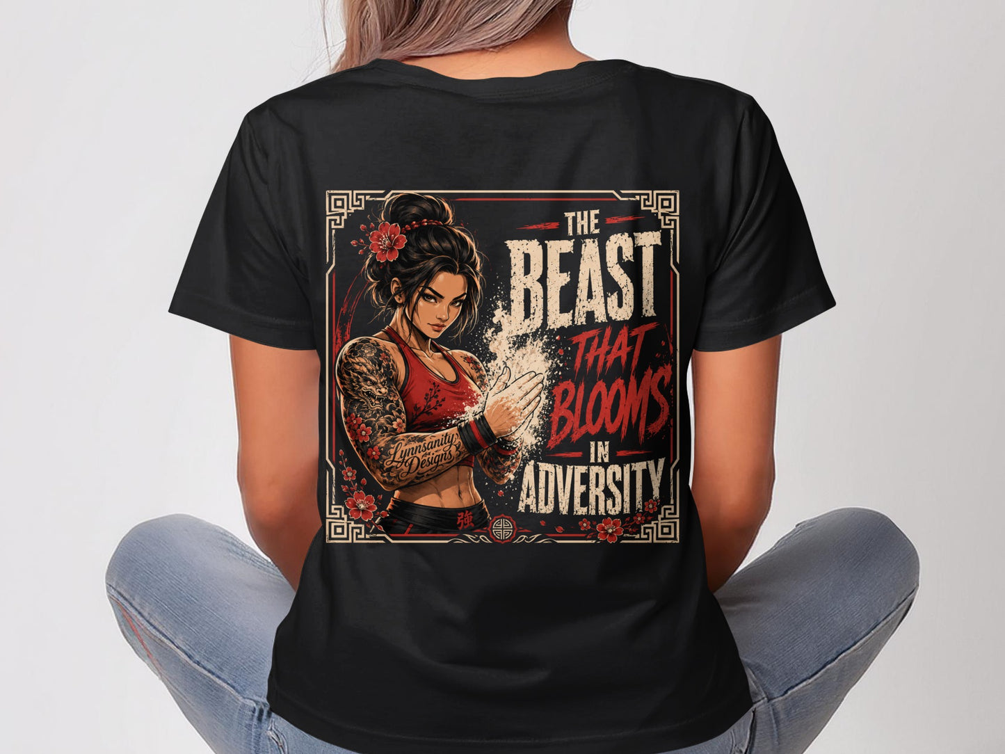 Black t-shirt with "The Beast That Blooms in Adversity" graphic.