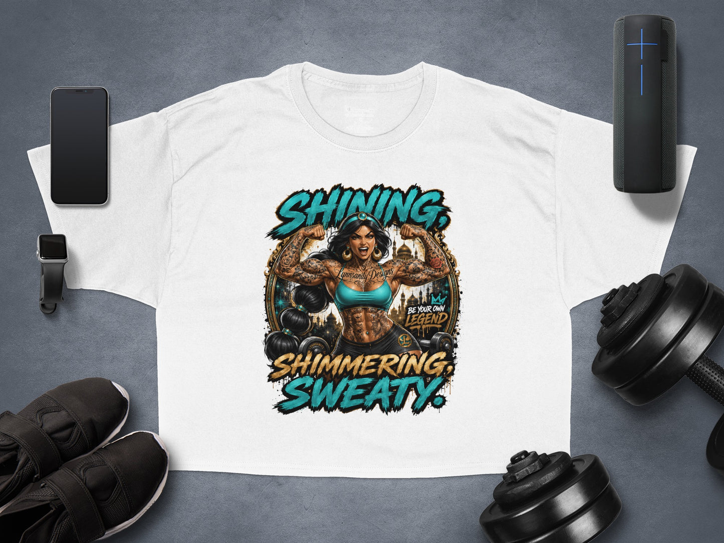 White cropped t-shirt with "Shining, Sweaty" text and tattooed woman flexing.