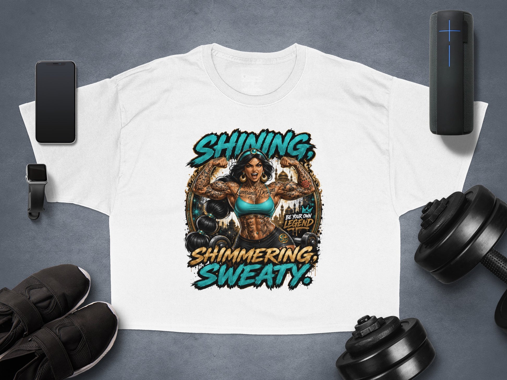 White cropped t-shirt with "Shining, Sweaty" text and tattooed woman flexing.