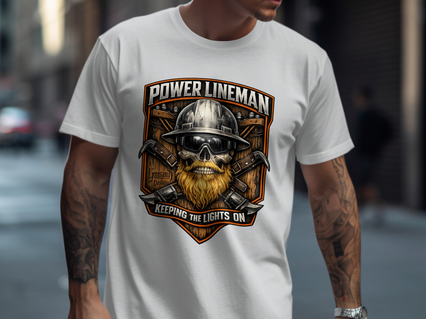 Power lineman graphic on white t-shirt with tools and helmet.