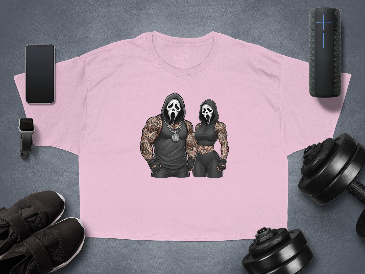 Cropped pink t-shirt with Ghostface graphics of a muscular man and woman.