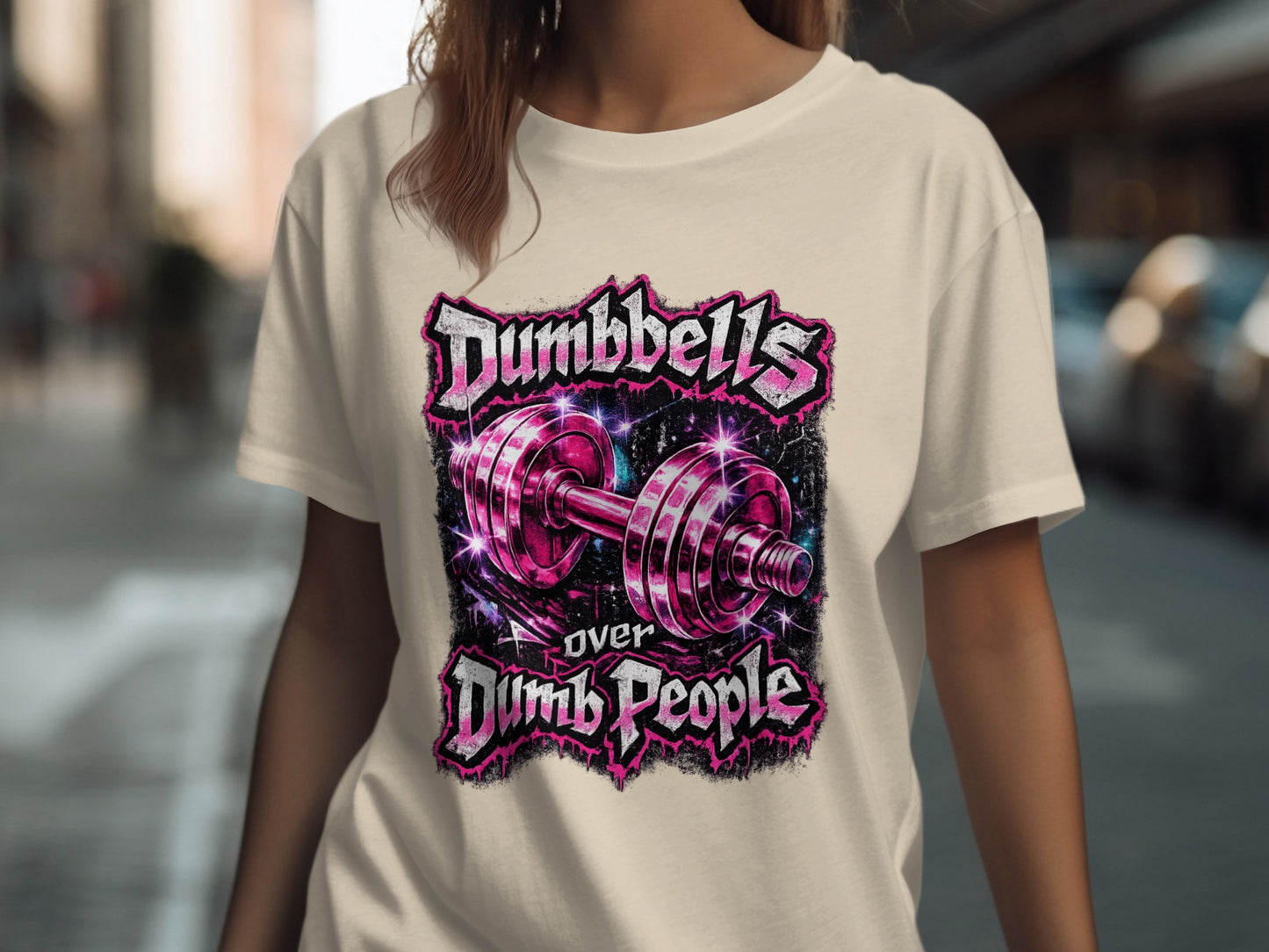 Cream t-shirt with "Dumbbells Over Dumb People" graphic.