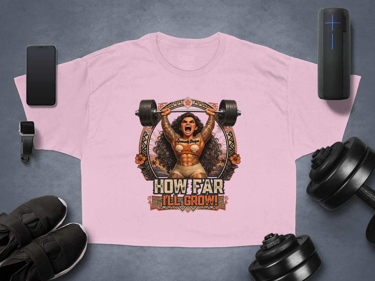 Pink cropped t-shirt with graphic of woman lifting barbell, text "HOW FAR I'LL GROW!"