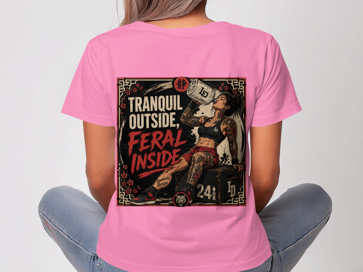 Woman in pink t-shirt with graphic of tattooed woman drinking from can.