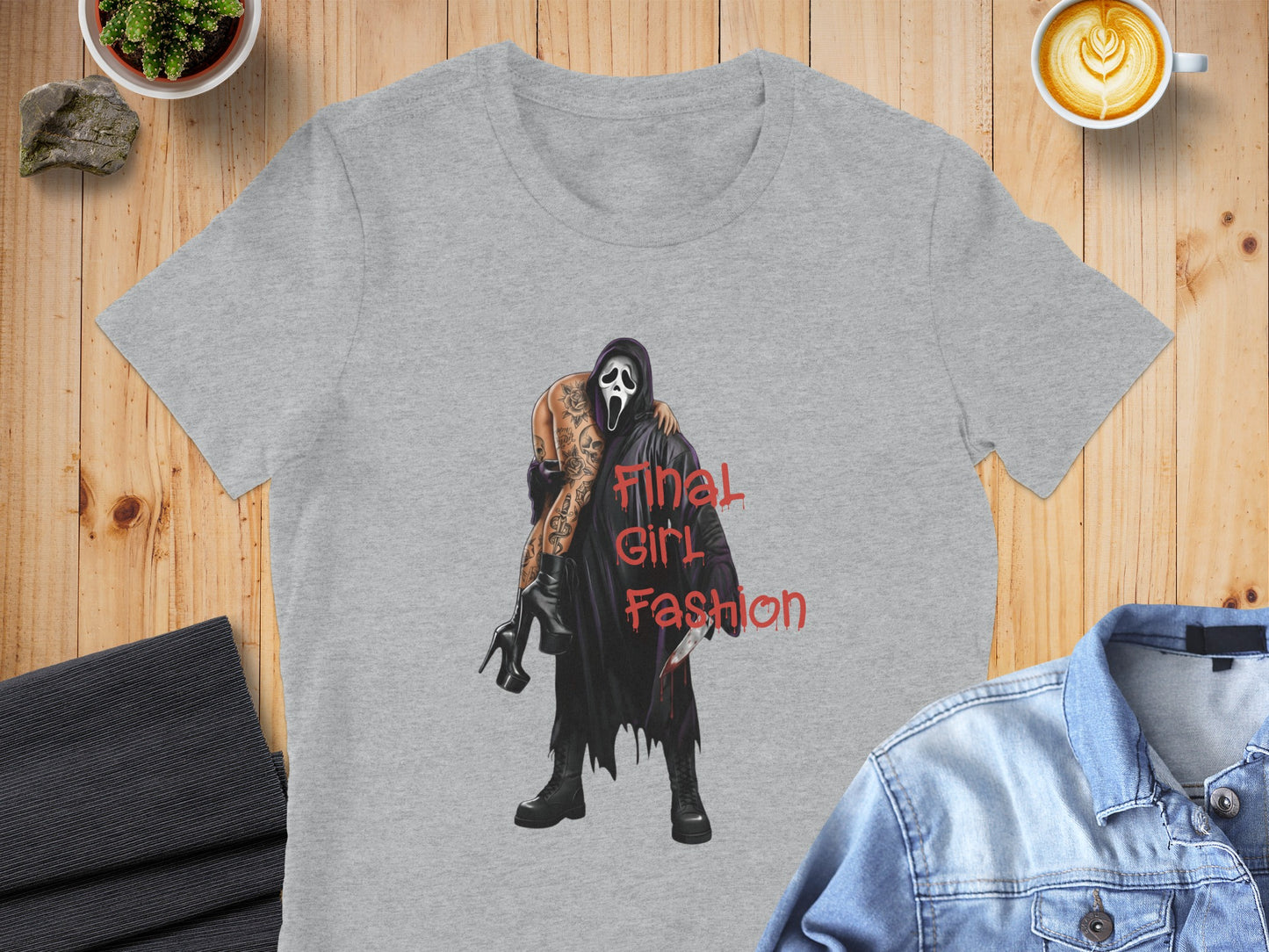 Grey t-shirt featuring a scary masked figure carrying a woman with "Final Girl Fashion" text.