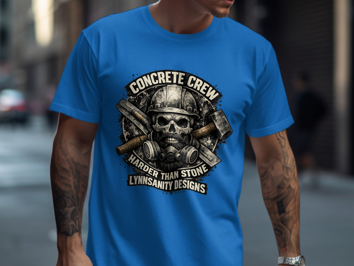 Skull with hard hat, mask, and tools on a blue t-shirt.