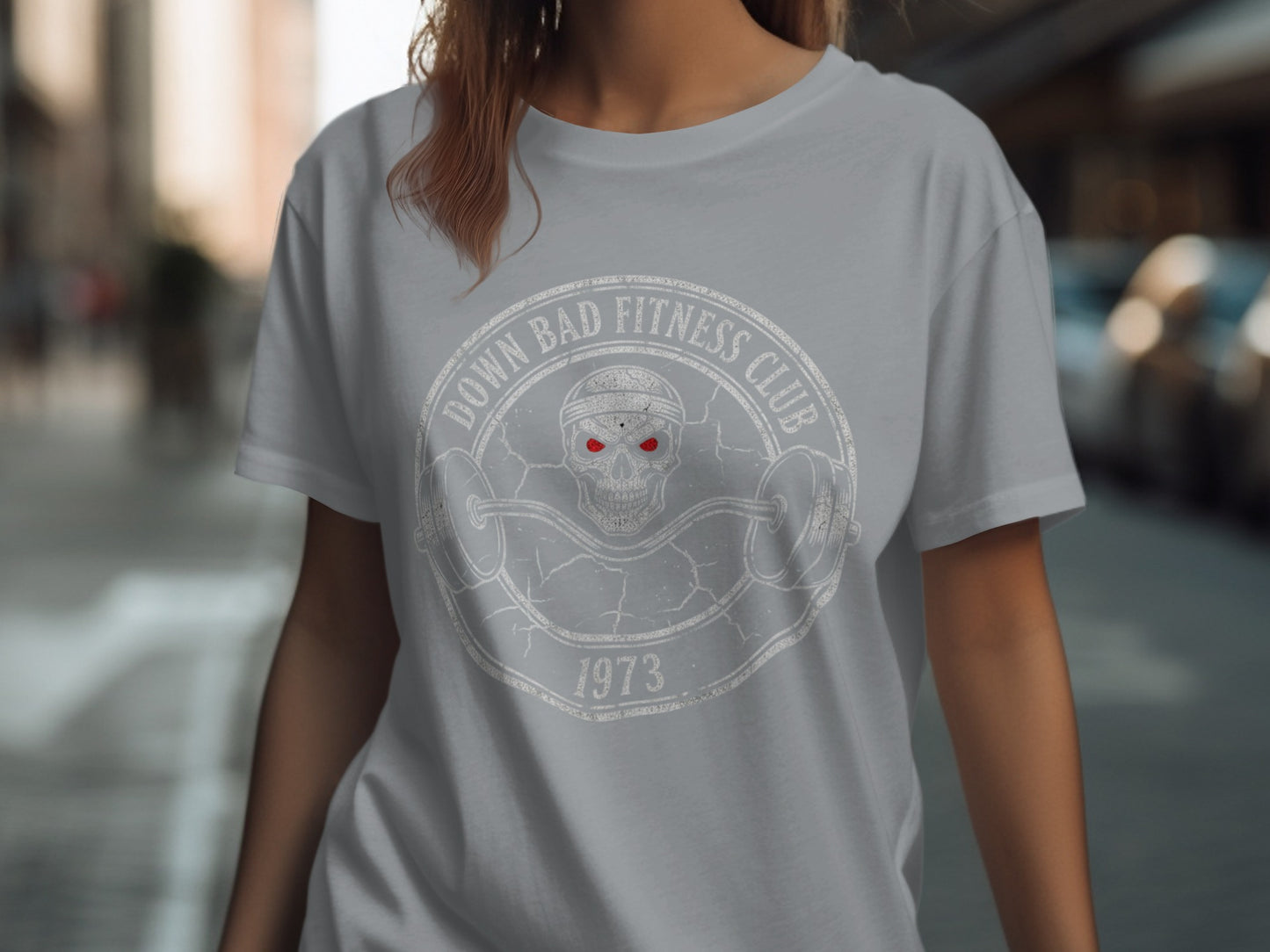 Gray t-shirt with "Down Bad Fitness Club 1973" skull logo and barbell.