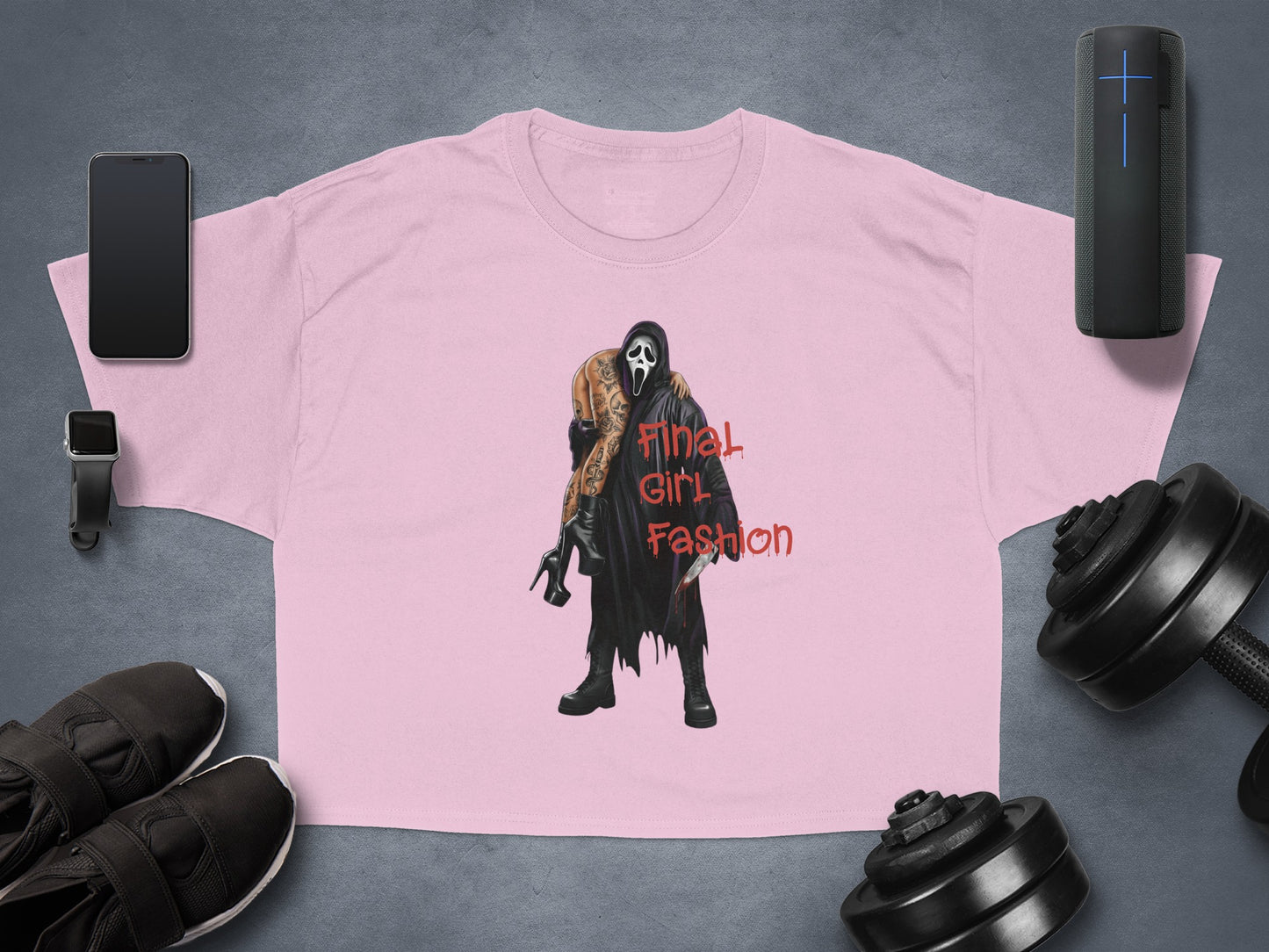 Pink t-shirt with "Final Girl Fashion" text and a horror movie character graphic.