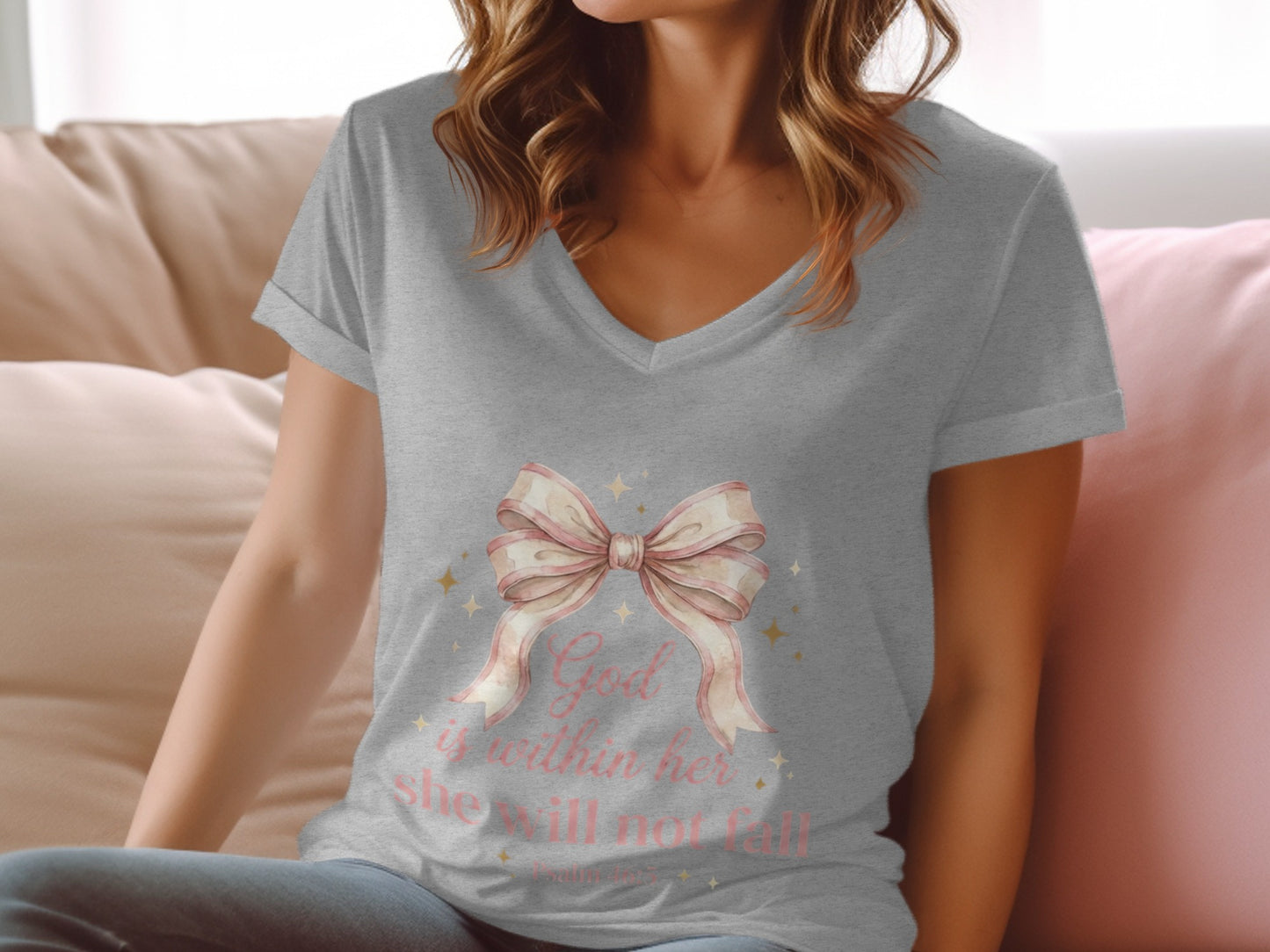 Gray t-shirt with pink bow and glittery stars; text reads "God is within her she will not fall."