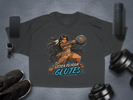 Tattooed woman in Native American attire lifts a kettlebell, text reads "Listen to your glutes."