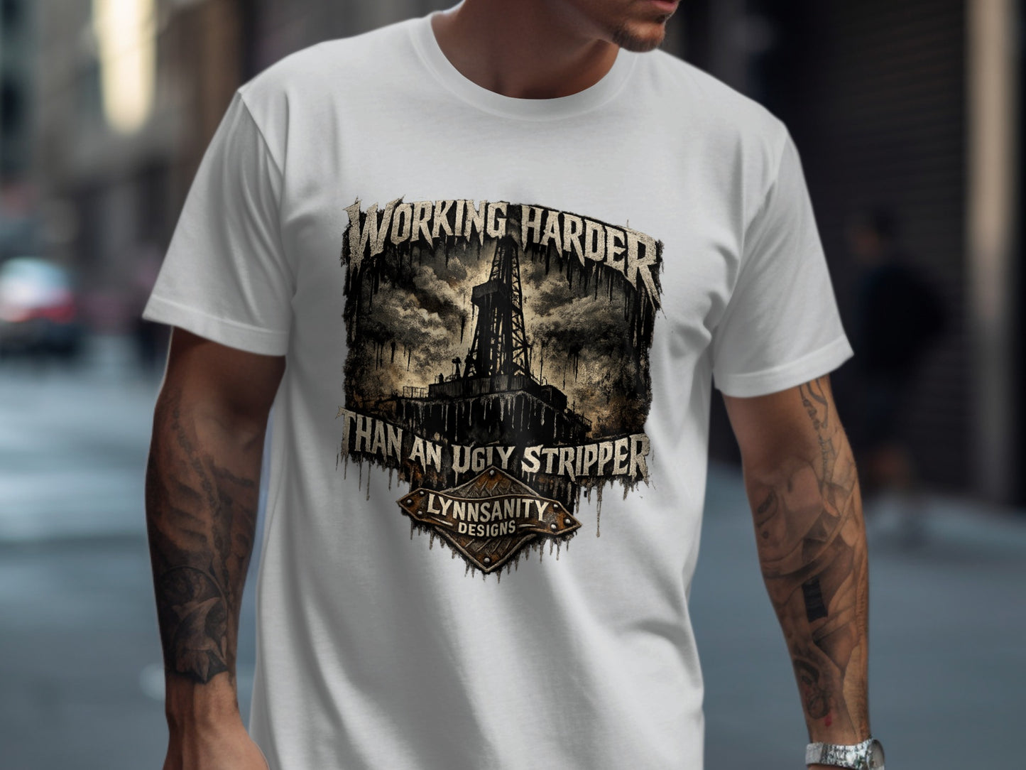 White t-shirt with "Working Harder Than An Ugly Stripper" graphic.