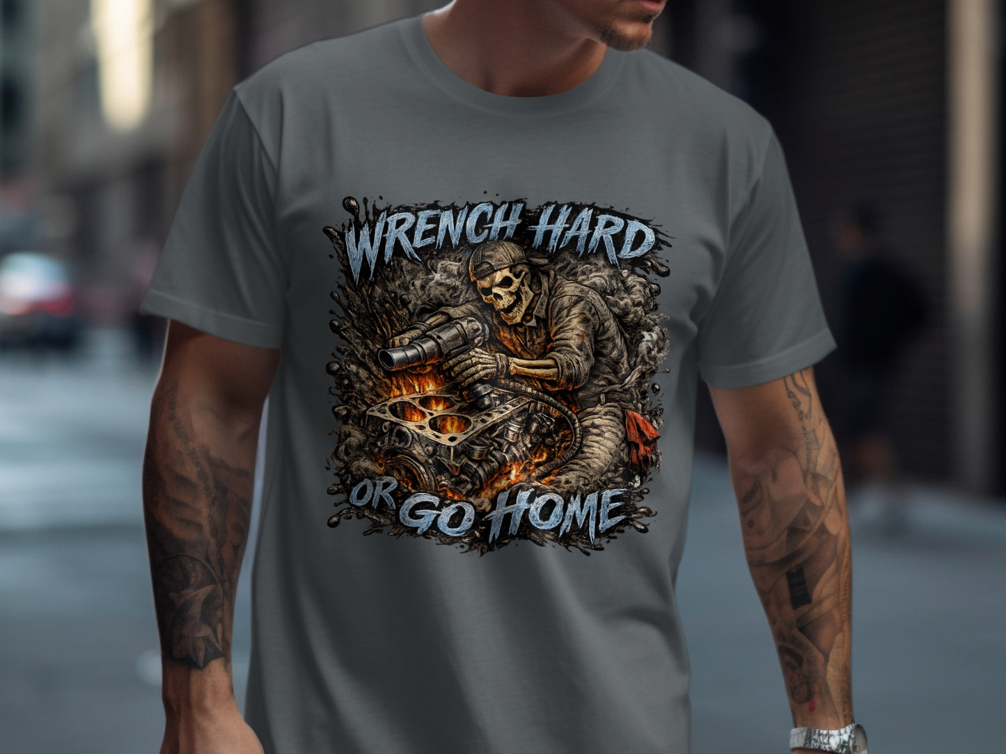Skeleton mechanic working on engine, text: Wrench Hard or Go Home.
