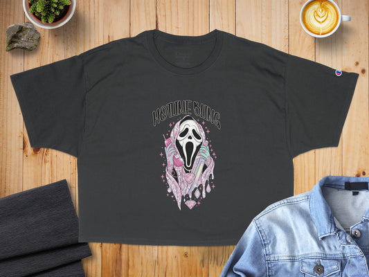 Dark t-shirt with graphic of Ghostface screaming and holding a pink phone.
