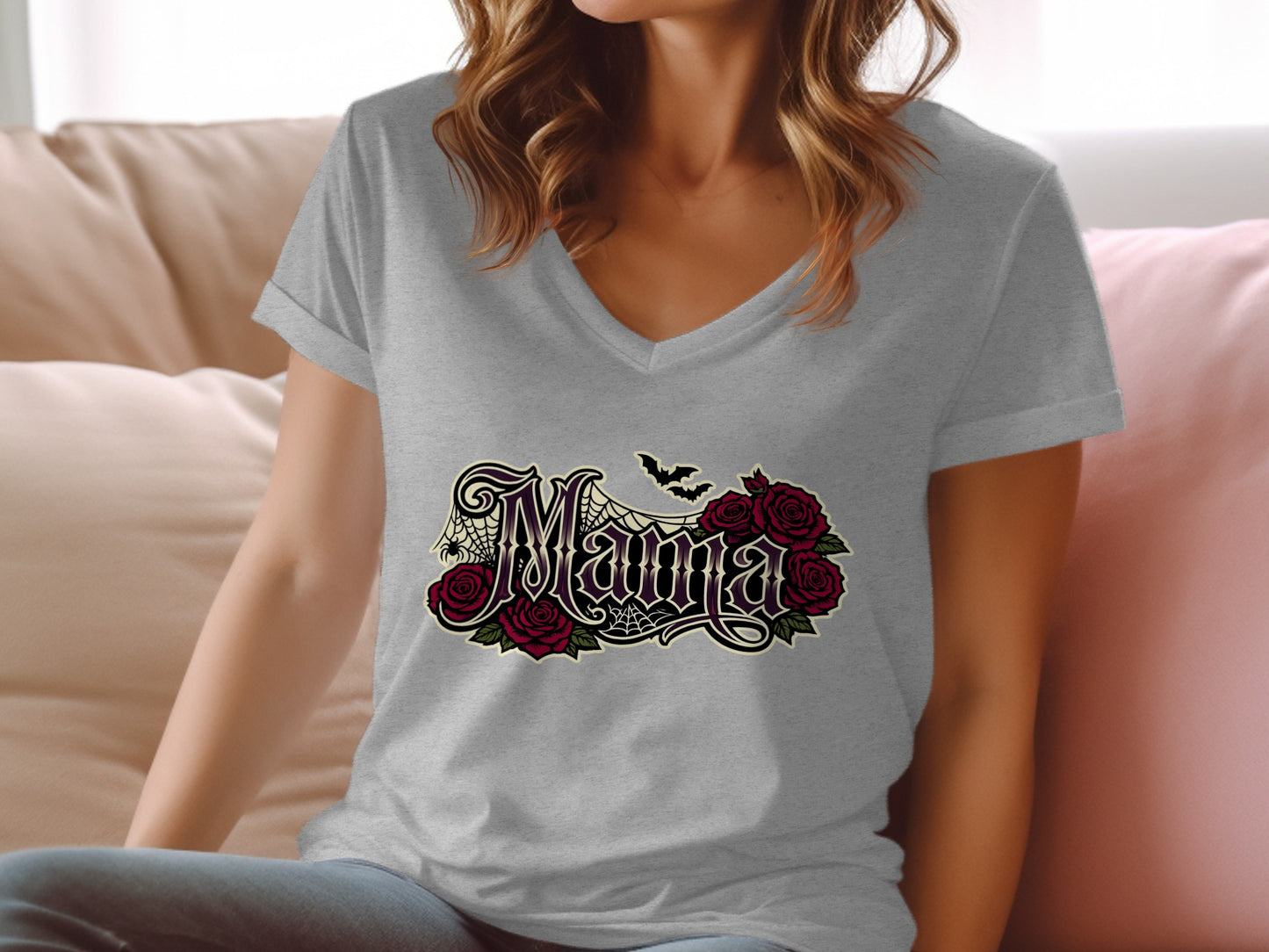 "Mama" text with bats and roses in gothic style on a gray v-neck t-shirt.