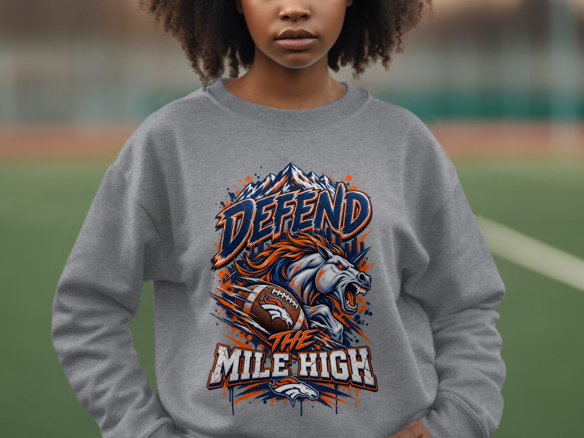 Grey sweatshirt with "DEFEND THE MILE HIGH" text, a horse, and football.