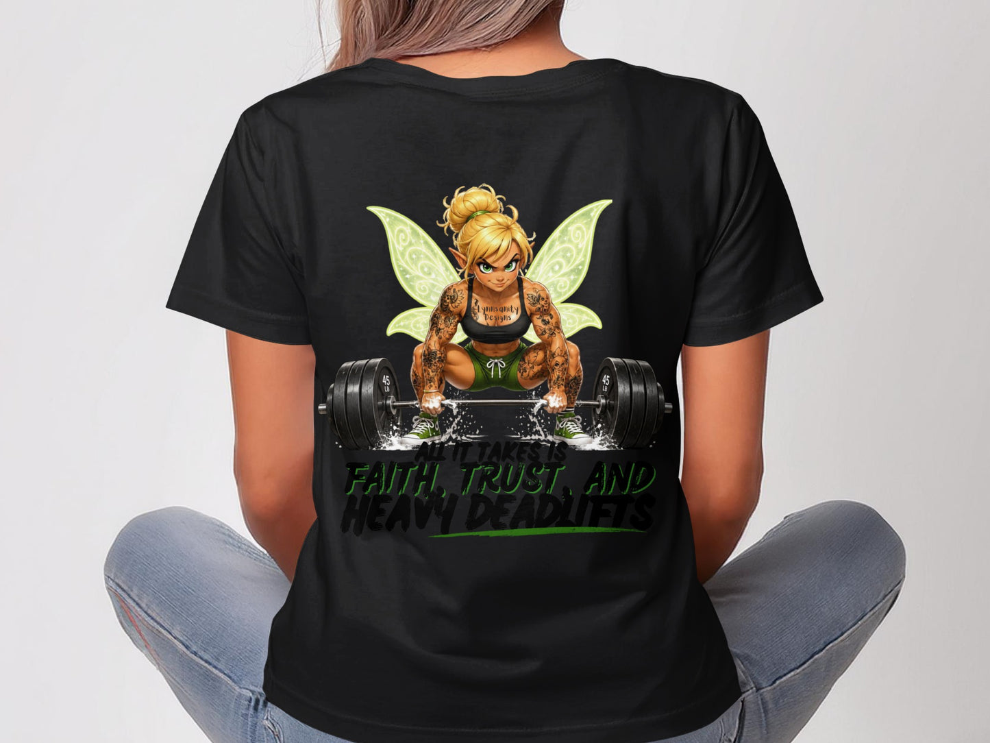 Woman in t-shirt with fairy lifting barbell; text "ALL IT TAKES IS FAITH, TRUST AND HEAVY DEADLIFTS".