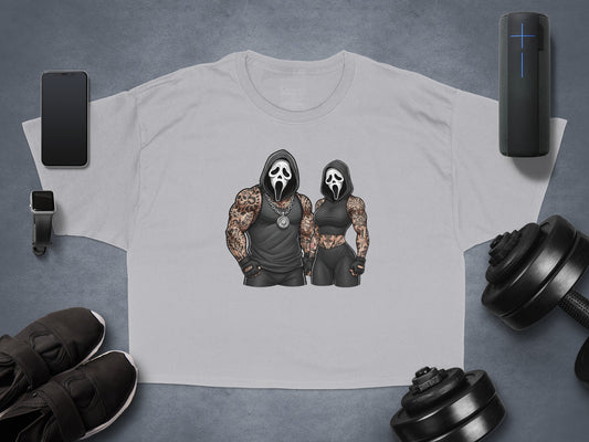 Two figures in Ghostface masks and athletic wear, displayed on a gray t-shirt.